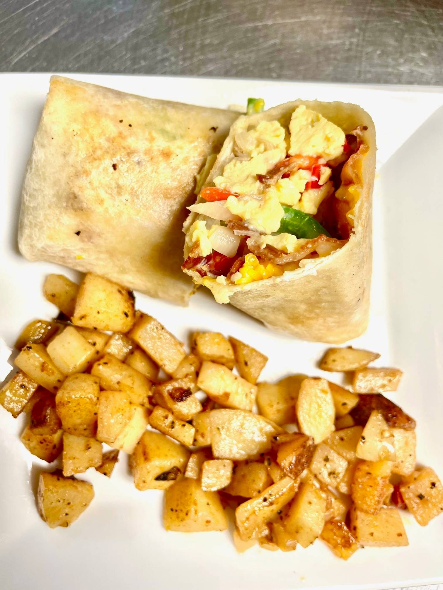 BREAKFAST BURRITO WITH HOME FRIES.