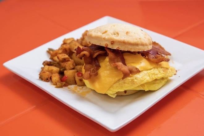 BISQUIT SANDWICH WITH HOME FRIES.